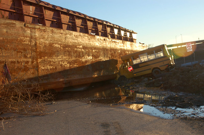 A photo of an abandoned school bus taken in  New Orleans' Ninth ward shortly after hurrican katrina