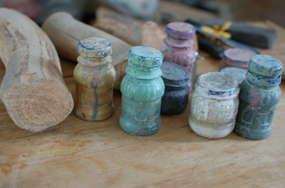 A photo of paint bottles taken when  Dr. SChmitt was gathering photos for her Navajo and Hopi art textbook. the paint is used to make katsina dolls